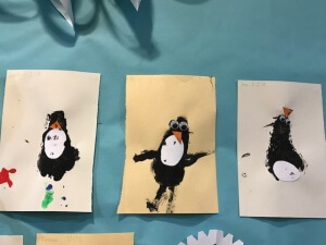 A string of happy painted pengiuns!