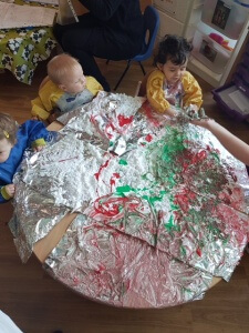 Babies enjoying some lovely messy sensory play!