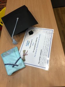 Our graduates received a mortar board, graduation certificate and small gift.